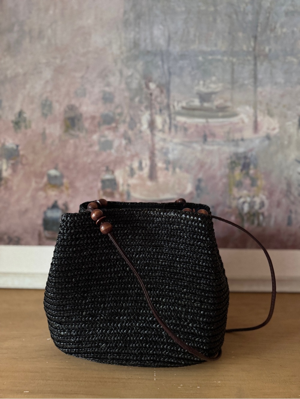 Elegant Black Wheat Straw Bucket Bag with Brown Decorative Straps - Picture 4 of 7